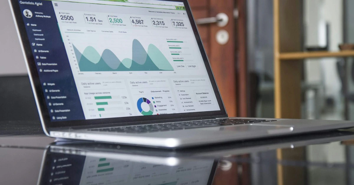 Laptop showing financial charts and data for business reporting and analysis